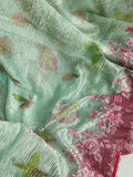 Crush tissue saree in aqua green with floral cutwork border