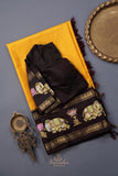 Yellow Gadwal Pattu saree with brown border and tanjore painting