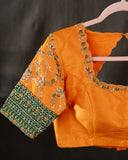 Kanchi soft silk saree in an evergreen green and light orange combo