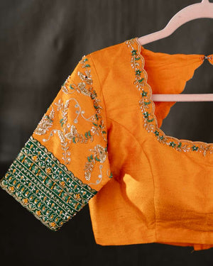 Kanchi soft silk saree in an evergreen green and light orange combo