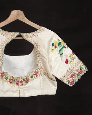 Off white blouse with beautifully designed Patola-inspired embroidery