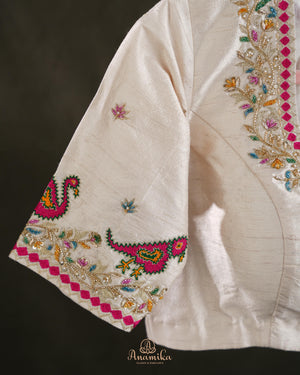 Off white blouse with beautifully designed Patola-inspired embroidery
