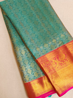 Turquoise Blue kanjeevaram saree with a contrast majenta pink border