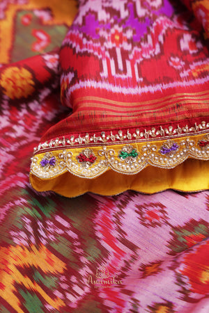 Patan Patola saree with intricately designed maggam work border
