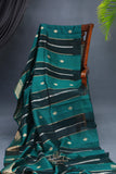A lovely organza saree in shaded dark green with a red designer blouse