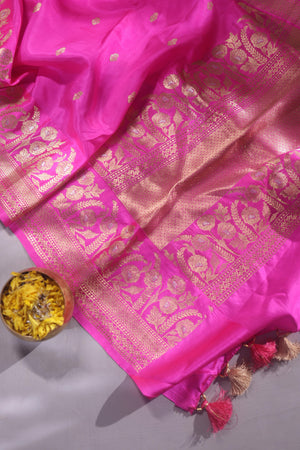 Raw Mango saree in bubble gum pink paired with a contrast dark green blouse
