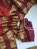 A stunning vintage kanjeevaram in rust orange with a deep maroon border