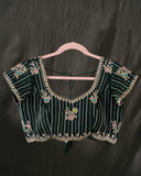 Banarasi Silk Saree in a dark emerald color