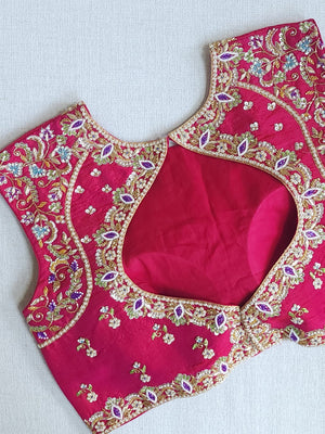 White floral pure silk saree with a contrast pink blouse