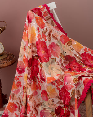 Beige Floral Chinnon saree with a contrast tomato pink handwork blouse