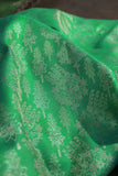 Green Kanjeevaram saree with a peach pink border