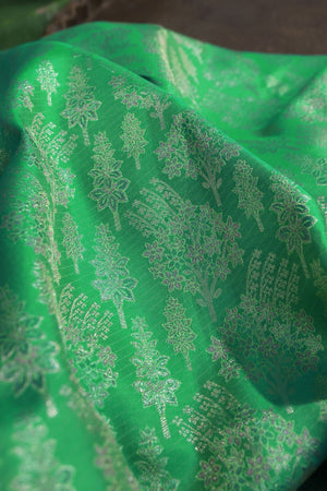 Green Kanjeevaram saree with a peach pink border