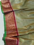 A Royal Gadwal kanchi saree in sage green with rich magenta border