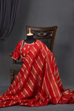A striking red Mashru silk saree with a designer blouse