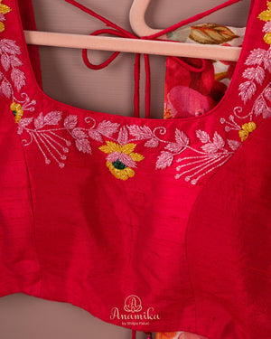 Beige Floral Chinnon saree with a contrast tomato pink handwork blouse