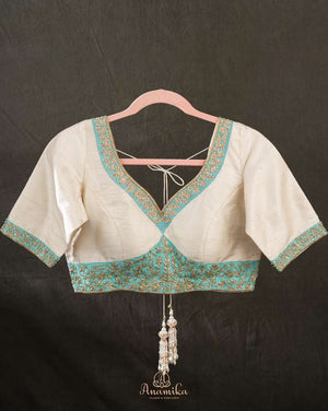 Off white blouse with blue patchwork embroidery