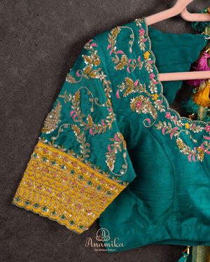 A meenakari kanjeevaram saree in yellow and teal