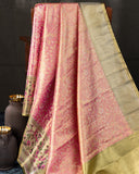Stunning kanjeevaram in a dual tone peach pink color with meenakari border