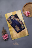 A lovely organza saree in shaded yellow with a dark blue designer blouse