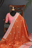 An exquisite Silk Saree in burnt orange and rose pink