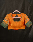 Kanchi soft silk saree in an evergreen green and light orange combo