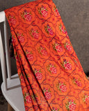Orange twill Patola saree with a contrast purple border