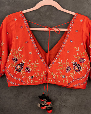 Orange Elbow sleeves blouse with intricately designed gold and black thread work