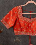 Orange Elbow sleeves blouse with intricately designed zardosi work