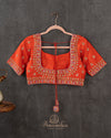 Orange Elbow sleeves blouse with intricately designed zardosi work