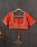 Orange Elbow sleeves blouse with intricately designed zardosi work