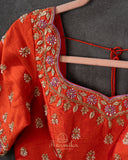 Orange Elbow sleeves blouse with intricately designed zardosi work