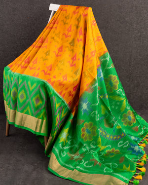 A Soft Silk Saree in shades of green and yellow with ikkat weave
