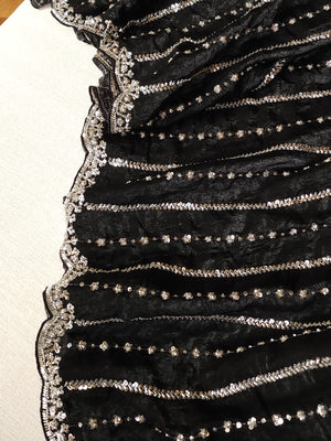 Falling organza saree in black with all over sequins work