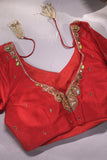 A stunning jewelry work blouse in red