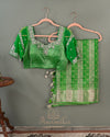 Parrot Green Crush Tissue saree with a stunning net sleeves blouse