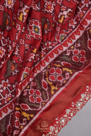 Patan Patola saree with intricately designed maggam work border
