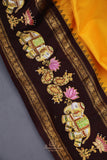 Yellow Gadwal Pattu saree with brown border and tanjore painting