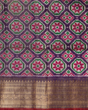 Light brown twill Patola saree with a contrast lavender border