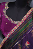 A classic patola in purple with a striking border