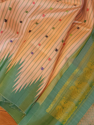 Gadwal saree in peach with beautiful contrast green temple borders