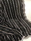 Falling organza saree in black with all over sequins work