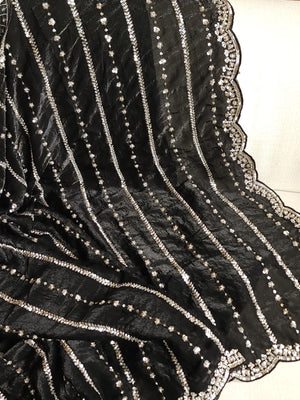 Falling organza saree in black with all over sequins work
