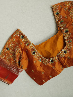 Traditional Green and rust orange Kanchipattu saree