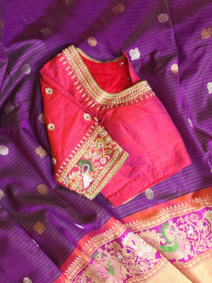 A Royal Gadwal kanchi saree in purple with contrast turning meena border