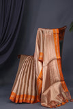 Banarasi brocade tissue saree in champagne with a beautiful light orange border