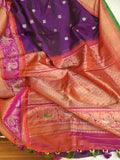 A Royal Gadwal kanchi saree in purple with contrast turning meena border