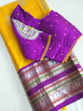 Venkatagiri Pattu saree in yellow with a contrast purple blouse