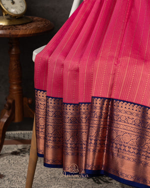 Kanchipattu saree in lovely rose pink shade with a contrast dark blue border