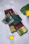 An exquisite kanjeevaram saree in deep maroon and emerald green combo