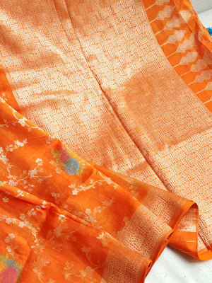Deep Orange Munga silk saree with contrast off white puff sleeves blouse